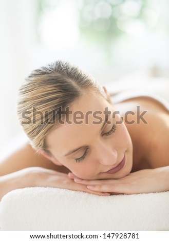 Close-up of relaxed young woman resting at health spa