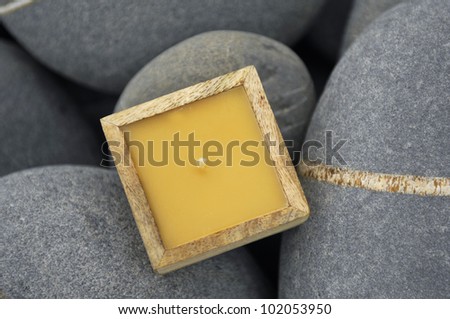 Spa area with stones and soap in wooden box