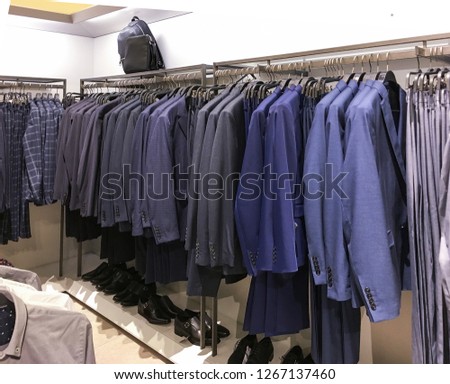 Set of Men's ,suits with shirts, shoes, , handbag in shop