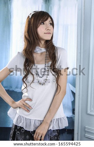 Portrait of an attractive young woman standing posing