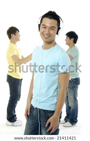 Asian happy university students over a white background-focus on man in blue