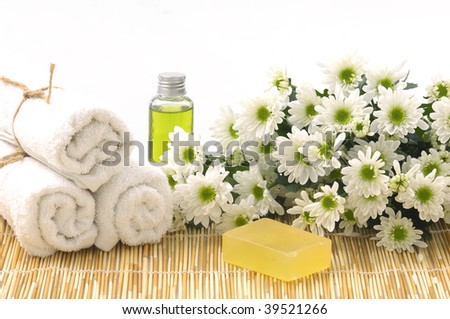 Body relax composition with towel, soap bars, oil, daisy