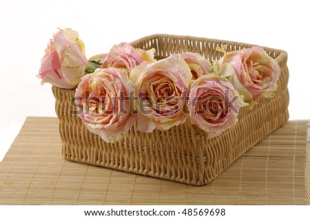 Arrangement of pink roses in a basket