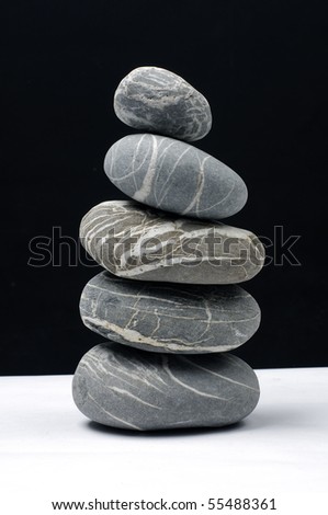 stones stack in balance on black