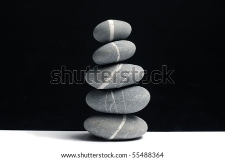 stones stack in balance on black