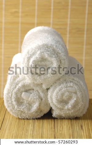 rolled up white spa towel