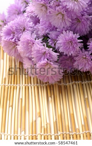 Laying down Bouquet pink Flower on woven mat