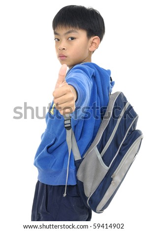 Asian smiling kindergarten boy gives thumbs up - stock photo
