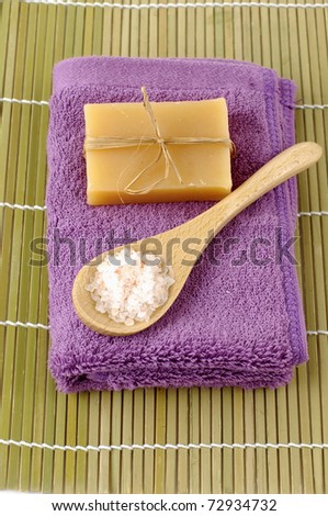 Sea Salt and Natural Soap on towel representing natural beauty