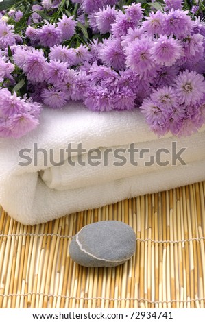 Bouquet flower with towel and stone on bamboo stick straw mat