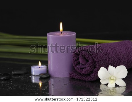 Spa feeling with towel, candle, green plant, White Gardenia
