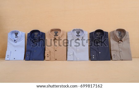 Business classic men's six, shirts on wooden background