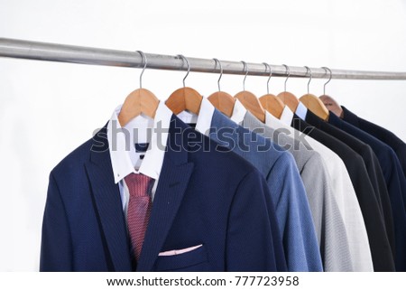 Row of men\'s suits hanger-white background
