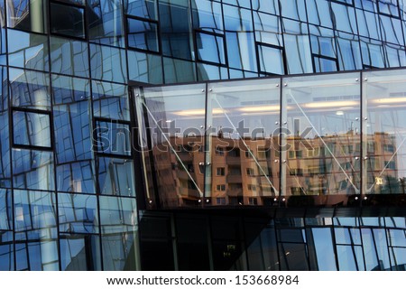 VIENNA, AUSTRIA - JUNE 29:  Reflection of community housing buildings in the the bridge connecting the Hoch Zwei highrise (OMV headquarters) to the Plus Zwei building shown on 29 June 2011 in Vienna.