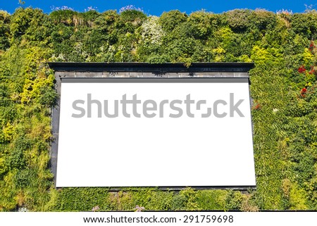 Blank billboard in a green building, for advertisement