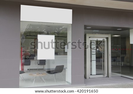 Office with blank showcase, with hanging billboard