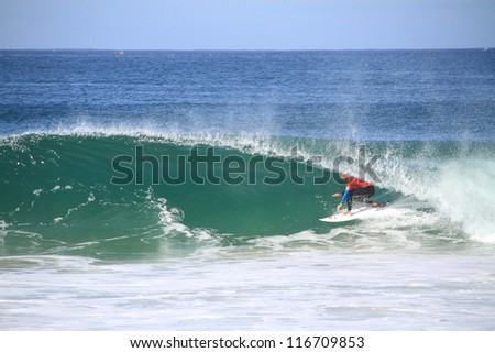 PENICHE, PORTUGAL - 2012 OCT 13: Kelly Slater tube riding a wave in round 1, heat 5 at WCT contest, Rip Curl Pro Peniche, Portugal 13 October 2012