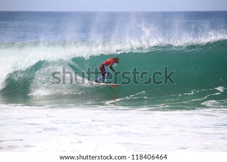 PENICHE, PORTUGAL - OCT 13: Owen Wright tube riding a wave in round 1, heat 7 at WCT contest, Rip Curl Pro in Peniche, Portugal on October 13, 2012