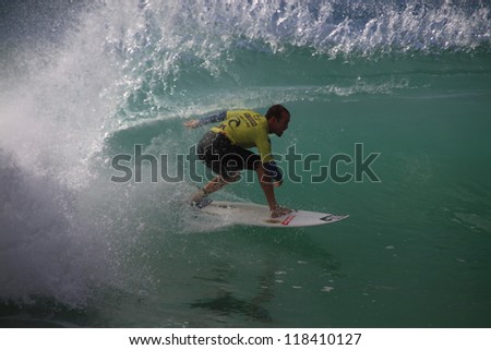 PENICHE, PORTUGAL - OCT 13: CJ Hobgood tube riding a wave in round 1, heat 11 at WCT contest, Rip Curl Pro in Peniche, Portugal on October 13, 2012
