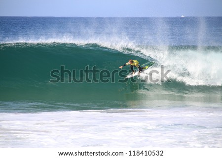 PENICHE, PORTUGAL - OCT 13: Damien Hobgood tube riding a wave in round 1, heat 5 at WCT contest, Rip Curl Pro in Peniche, Portugal on October 13, 2012