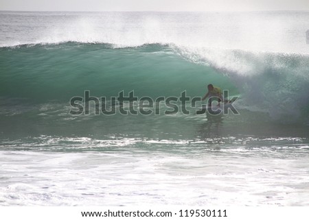 PENICHE, PORTUGAL - OCT 13: Jadson Andre tube riding a wave in round 2, heat 5 at WCT contest, Rip Curl Pro in Peniche, Portugal on October 13, 2012
