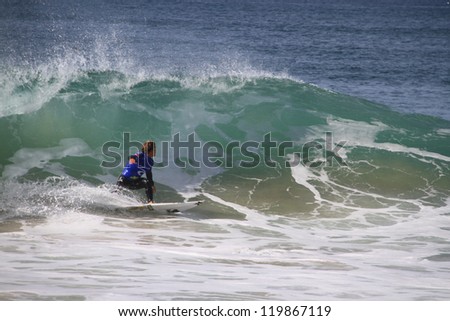 PENICHE, PORTUGAL - OCT 13: Yadin Nicol tube riding a wave in round 1, heat 7 at WCT contest, Rip Curl Pro in Peniche, Portugal on October 13, 2012