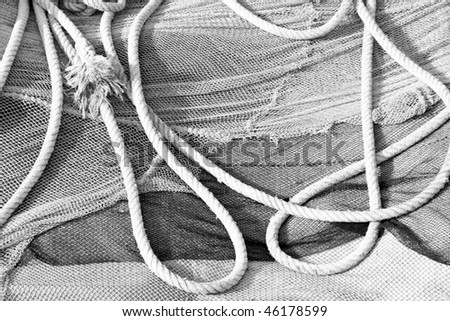 Ropes and fishing nets (black and white photo)