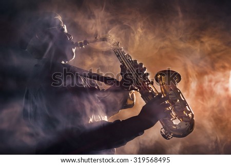 African jazz musician playing the saxophone. Orange color
