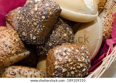 Basket with fresh baked whole wheat bread and white buns