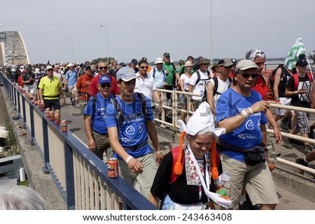 NIJMEGEN, THE NETHERLANDS  16 JULY 2013  People from all over the world walk over de bridge in Nijmegen around 50 kilometers per day, four days long. It is a yearly event in July.