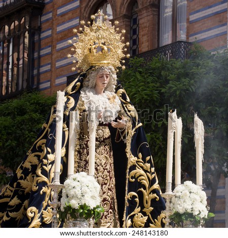 SEVILLE, SPAIN - 16 MARCH 2014: Procession with Maria Auxiliadora in the district La Triana, Seville, Spain. Photo taken on March 16th 2014 in Seville, Spain.