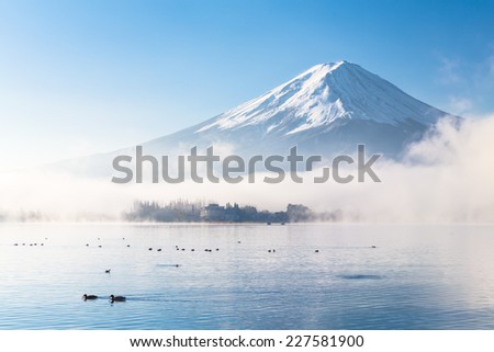Mountain Fuji and Kawaguchiko lake with morning mist in autumn season