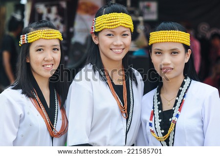 Kota Kinabalu, Sabah Malaysia - MAY 30, 2012 : Lundayeh tribe ladies in traditional costume pose for the camera during Harvest Festival celebration on May 30, 2012 in Kota Kinabalu, Sabah, Malaysia.