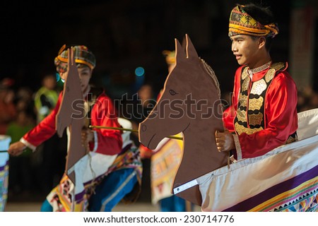 Kota Belud, Sabah Malaysia. October 18, 2014 : A group of dancers  in colorful traditional costume performing Kuda Kepang dance during folklore festival in Kota Belud Sabah.