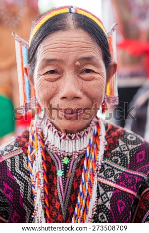 Kota Kinabalu, Sabah, Malaysia - May 31 2014: Portrait of unidentified lady from the Dusun Rumanau Leboh ethnic in colorful traditional costume during harvest festival celebration at Sabah Borneo.