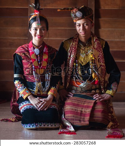 Penampang, Sabah Malaysia.May 31, 2015 : Dusun Lotud couple wearing colorful traditional costume during Pesta Kaamatan or Harvest Festival in Sabah Borneo.Image with shadow using natural lights.
