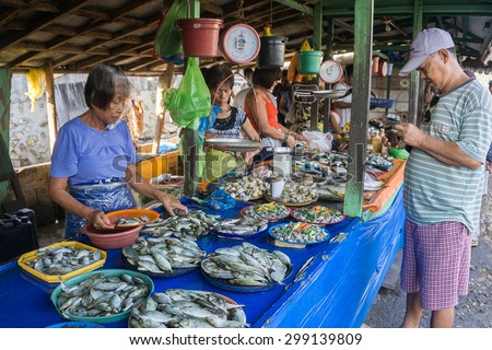 Tagbilaran, Bohol Philippines - May 22, 2015 : Unidentified people sell fish at a street market on May 22, 2015 in Tagbilaran Bohol Philippines. Seafood is daily diet for most Pilipino.