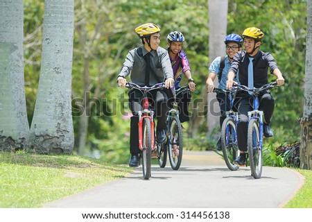 Kota Kinabalu Sabah Malaysia - Sep 11, 2014:A group of unidentified university student cycling to attend class.Most university in Malaysia encourge student to opt cycling in their campus activity.