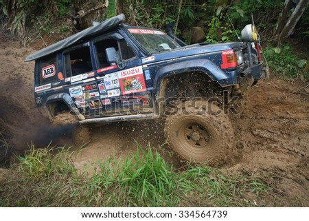 Tenom Sabah, Malaysia - Oct 26, 2015:An extreme 4X4 car passing a muddy trail of jungle route in the rainforest of Sabah Malaysian Borneo.Sabah jungle is popular for 4X4 adventures.