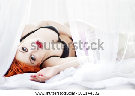 Red haired girl in bed