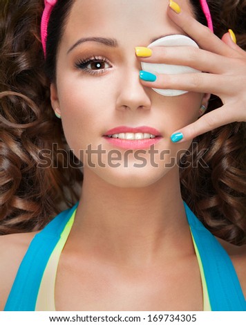 Make up removal concept, woman with cotton pad