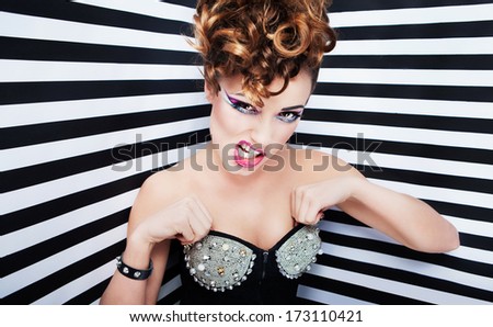 Portrait of beautiful young woman with professional party make up false eyelashes