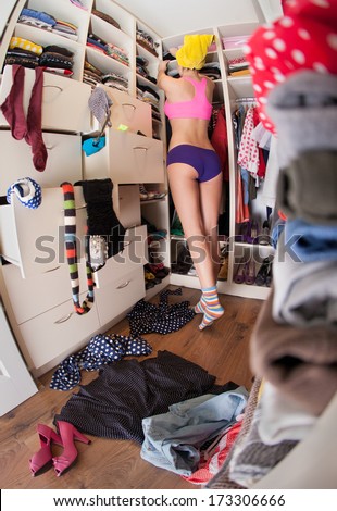 Getting dressed concept, woman after shower in walk in closet