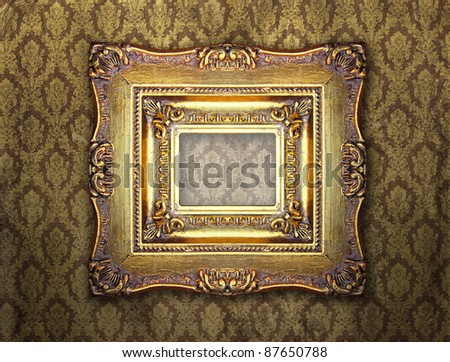Ornamental gold frame on an aged damask wallpaper, similar available in my portfolio
