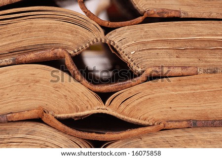 Open pages of old books in horizontal row