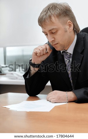 office manager reading the document
