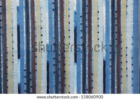 Structure of mesh fabric for a background, points and vertical strips of various color