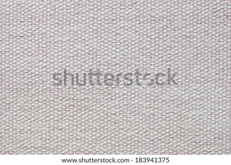 abstract background of light pink coarse-grained texture of rough fabric with an interlacing