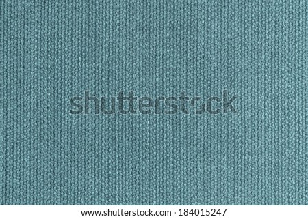 abstract texture of knitted woolen fabric for a background turquoise color