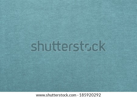 abstract texture of cotton fabric with synthetics for backgrounds and wallpaper of turquoise color closeup